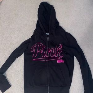 Black hoodie with PINK worded on the front in pink.